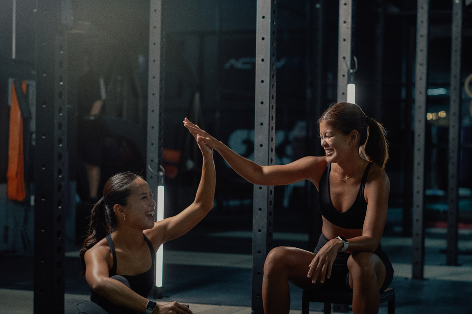 Female Trainers and Weightlifting Women in a Gym